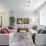 Modern sitting room in a villa for sale in Turkey with comfortable sofas and natural light