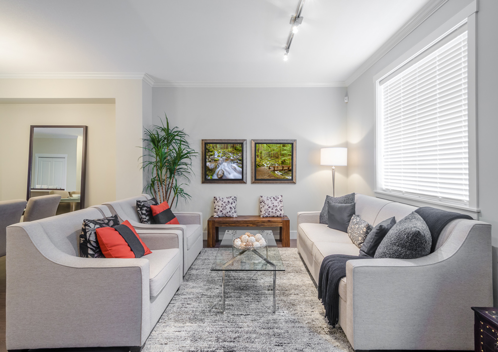 Modern sitting room in a villa for sale in Turkey with comfortable sofas and natural light