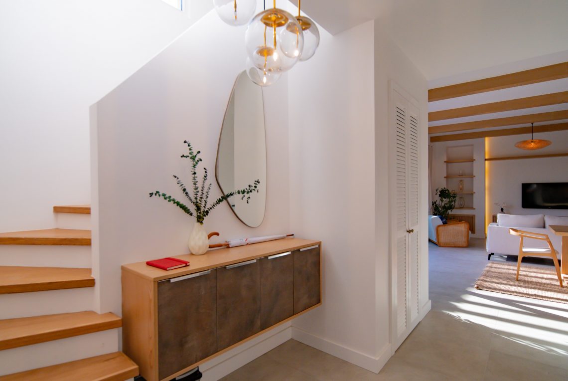 Modern wooden staircase with sleek design and metal railings