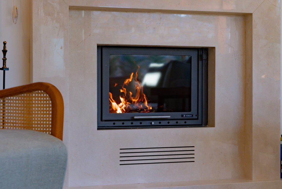 Cozy living room with a modern fireplace and comfortable seating
